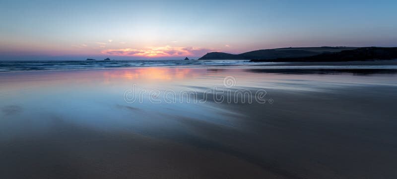 Sunset over beautiful deserted beach, Constantine Bay, Cornwall