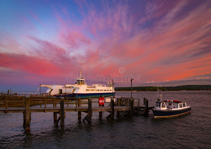 Sunset over Boats in Poole Harbour stock images