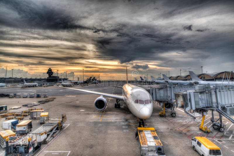 Sunset Over Commercial Aircrafts on Airport Tarmac