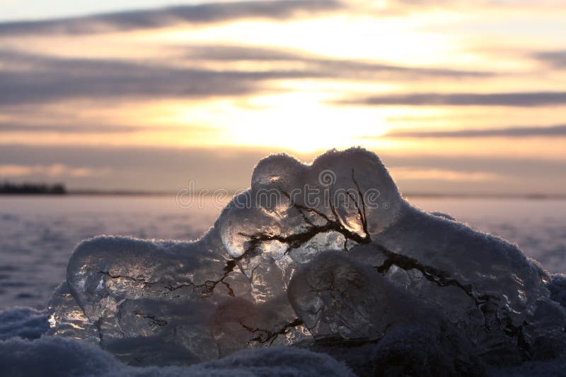 Sunset over frozen lake