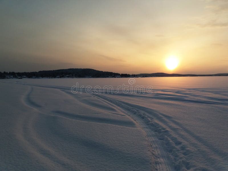Sunset over the frozen lake in winter royalty free stock photography Sunset over the frozen lake in winter royalty free stock photography