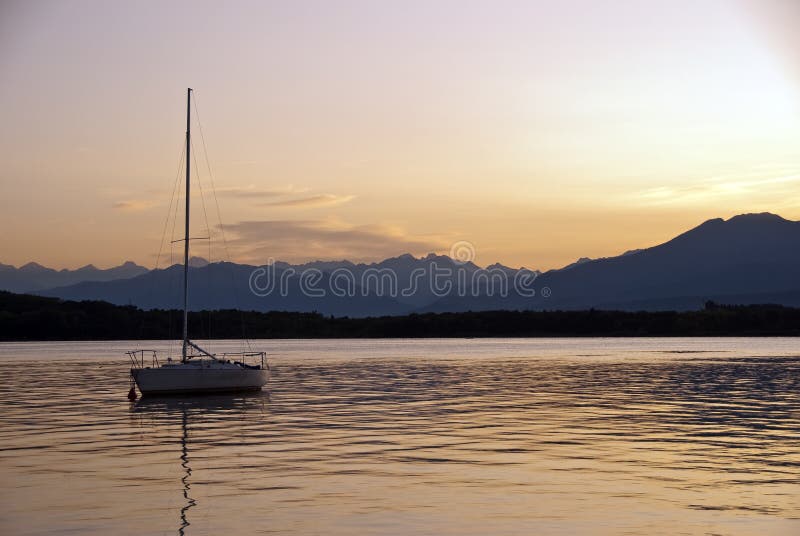 Sunset over Lake Viverone with a boat, Italy. Sunset over Lake Viverone with a boat, Italy