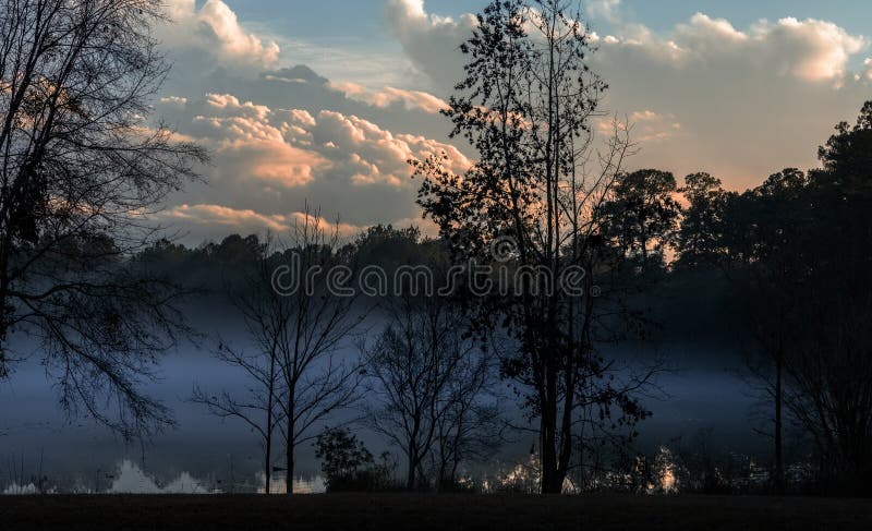 Sunset over a Misty Lake