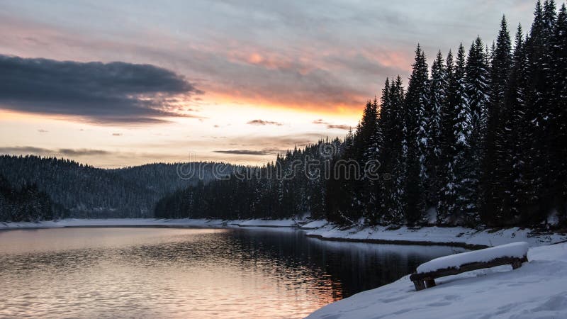 Sunset over a mountain lake. stock photos Sunset over a mountain lake. stock photos