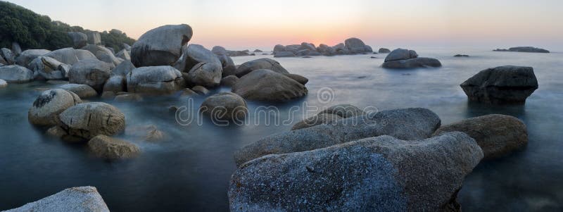 Sunset over rocky beach