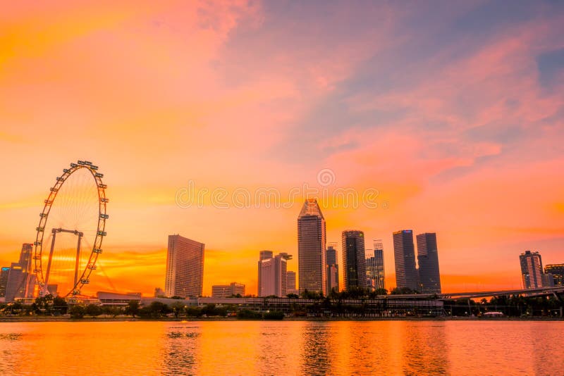 Sunset over Singapore and Ferris Wheel stock photo Sunset over Singapore and Ferris Wheel stock photo