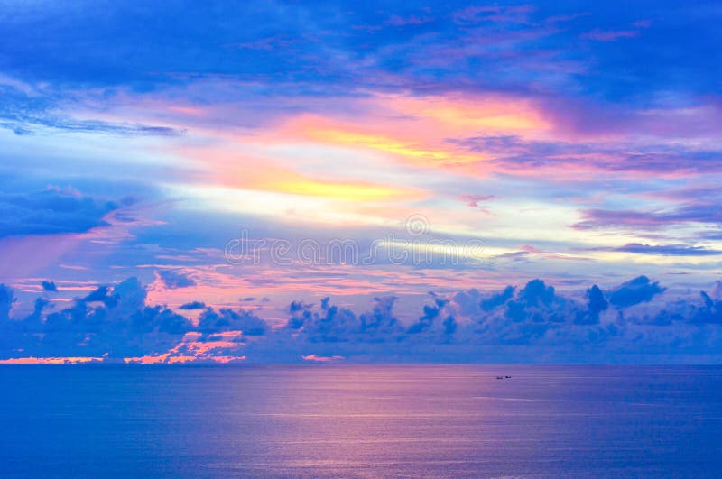Sunset over small boats in the tropical sea landscape at Promthep cape, Phuket,Thailand royalty free stock photography Sunset over small boats in the tropical sea landscape at Promthep cape, Phuket,Thailand royalty free stock photography