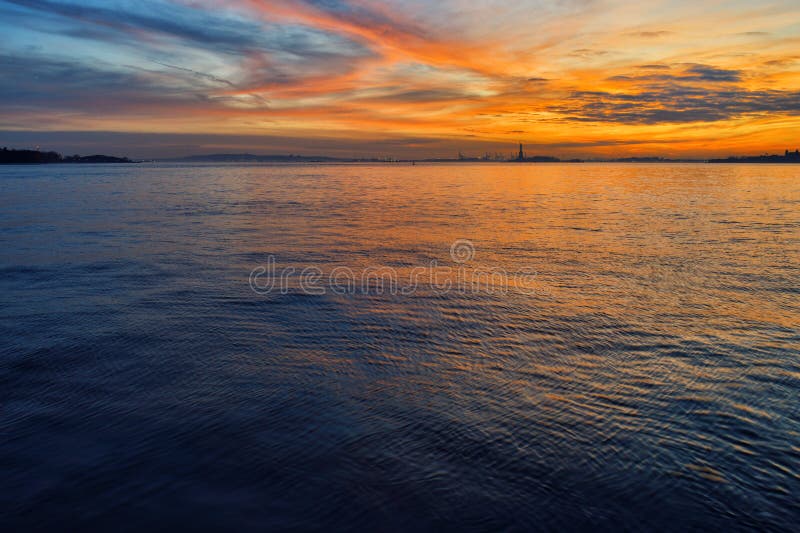 Sunset over a Statue of Liberty stock photo Sunset over a Statue of Liberty stock photo