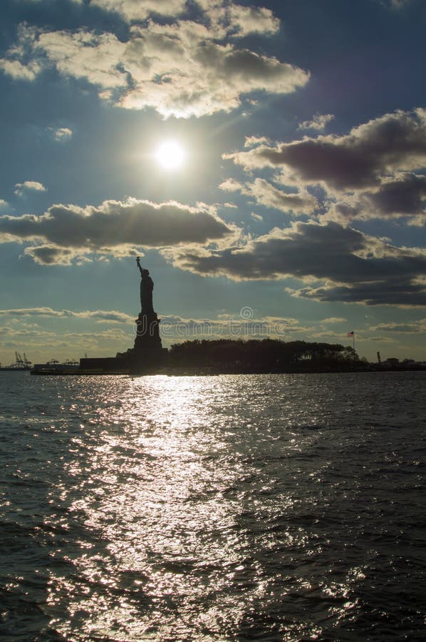 Sunset behind the statue of Liberty stock image Sunset behind the statue of Liberty stock image