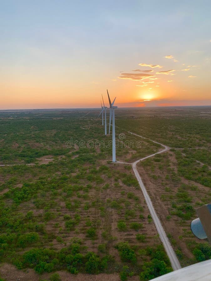 A stunning sunset over a wind farm in West Texas. Texas wind energy turbines stock images, royalty-free photos and pictures
