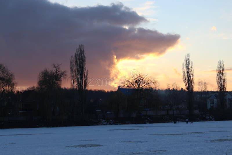 sunset over the winter lake stock photos sunset over the winter lake stock photos