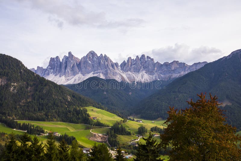 Sunset and rainbow in Val Di Funes, Dolomites, Alps, Italy