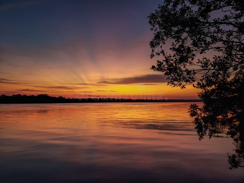 Sunset on the river in the summer and wooden pier royalty free stock photos Sunset on the river in the summer and wooden pier royalty free stock photos