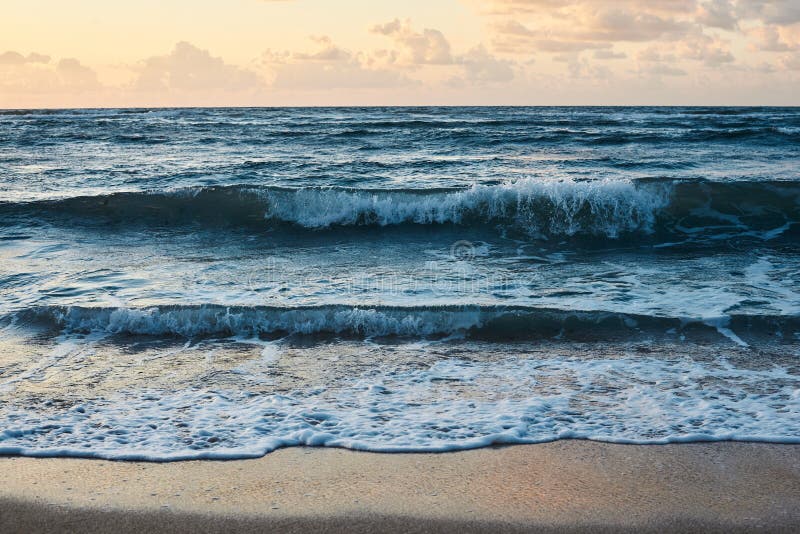 Sunset At The Rocky Sea Turquoise Water In The Ocean In The Evening