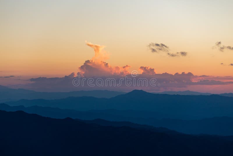 Sunset scene with silhouette mountain