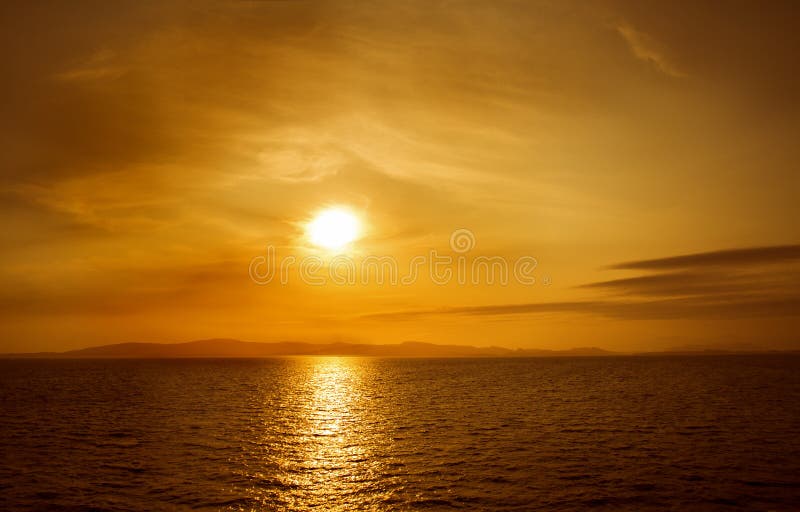Sunset on sea. Bright sun on sky. beach landscape