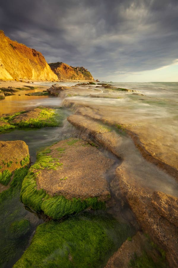 Sunset seascape with heavy clouds stock photography