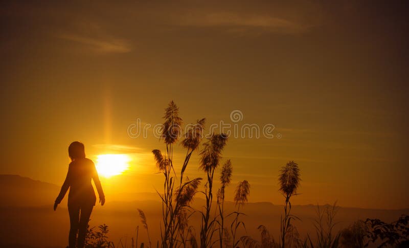 Sunset silhouette Young woman alone