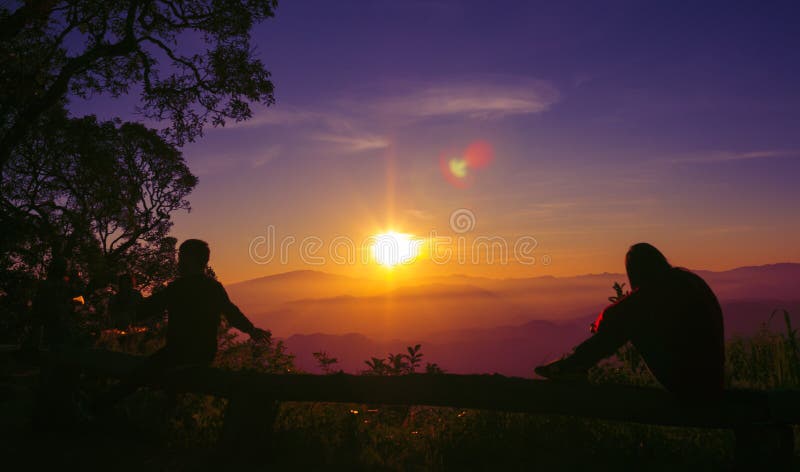 Sunset silhouette Young woman sad stock images