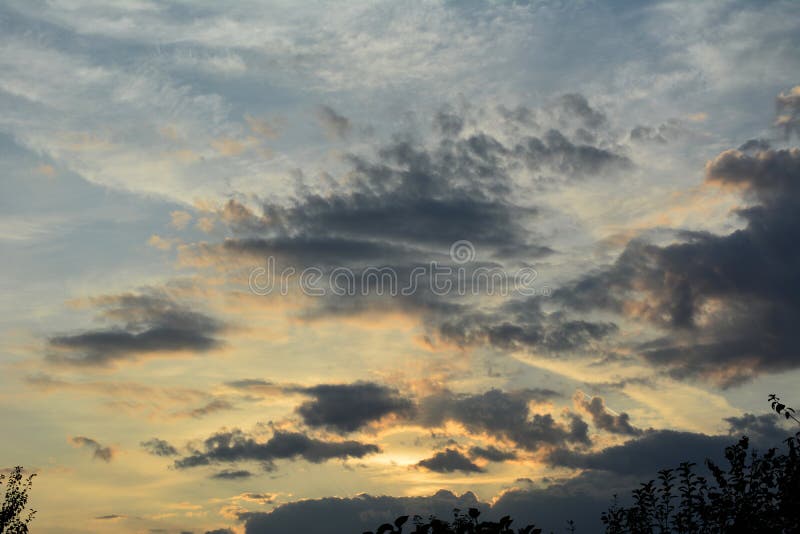 Sunset sky in the evening with light and dark clouds.  stock images