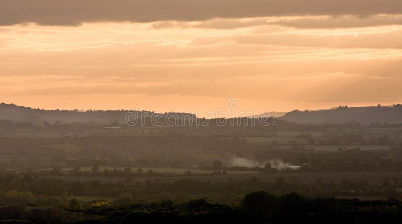 Sunset sky over a smoky Warwickshire landscape