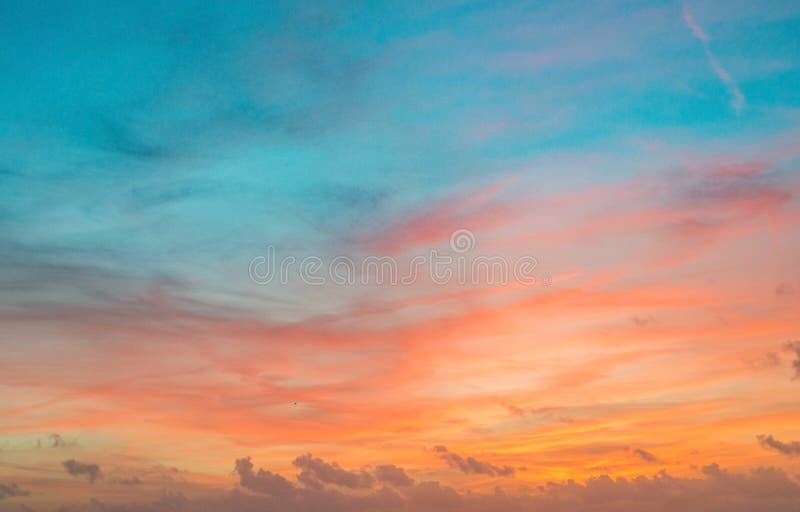 Sunset sky in red and blue color with subtle clouds