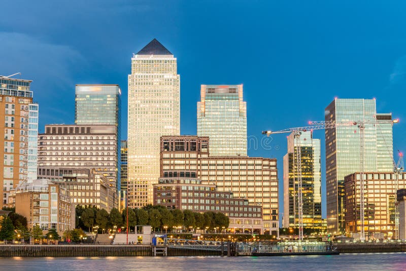 Sunset skyline of Canary Wharf, London reflections royalty free stock photography