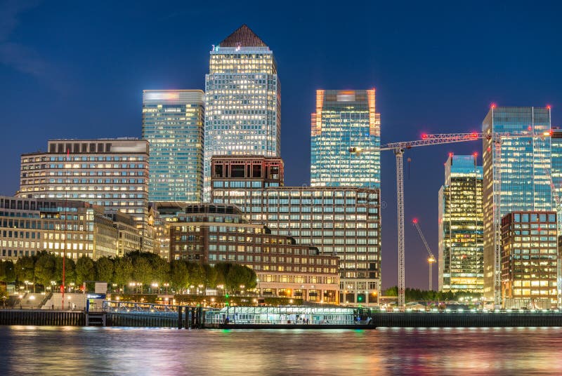 Sunset skyline of Canary Wharf, London reflections royalty free stock image