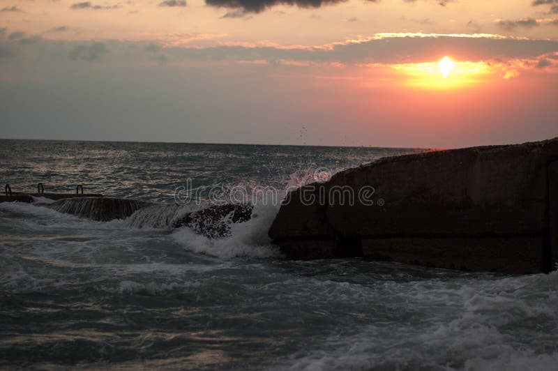 Sunset, storm on the sea.waves, breakwater stock photos Sunset, storm on the sea.waves, breakwater stock photos