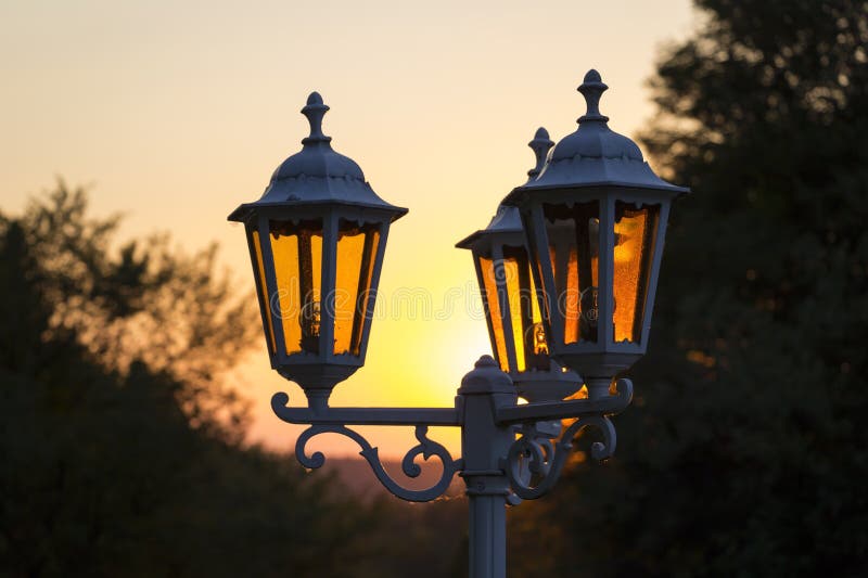 Sunset and street lamps provide a romantic atmosphere royalty free stock image Sunset and street lamps provide a romantic atmosphere royalty free stock image