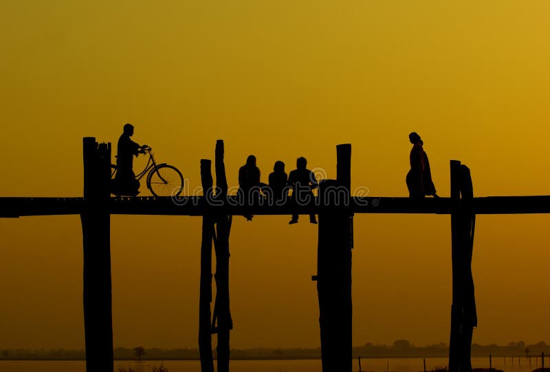 Sunset at U-Ben Bridge with myanmar people