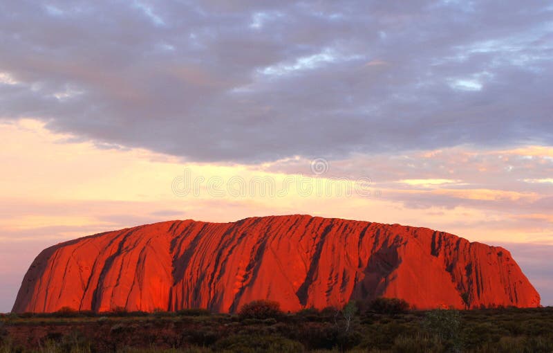 Uluru Ayers Rock (Unesco) is on fire at sunset, Australia