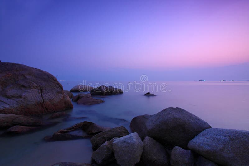 Sunset under long exposure along seashore