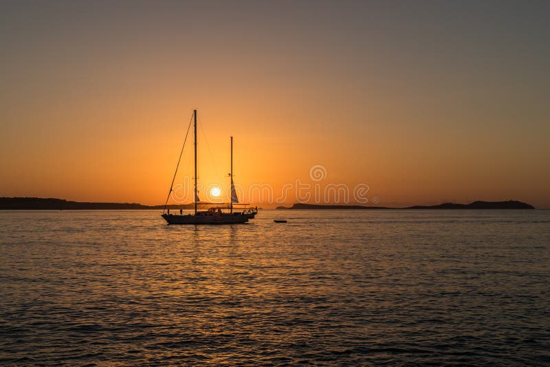 Sunset view an a sailing boat at the Cafe del Mar on Ibiza. Sunset view an a sailing boat at the Cafe del Mar on Ibiza