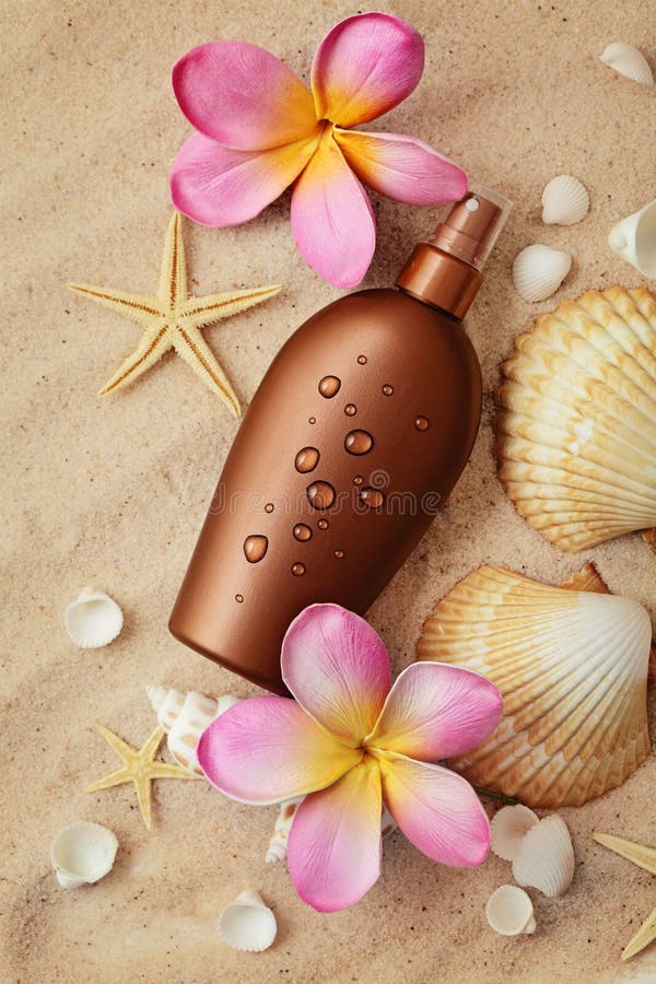Suntan Lotion Container And Seashells On Sand Stock Image Image of