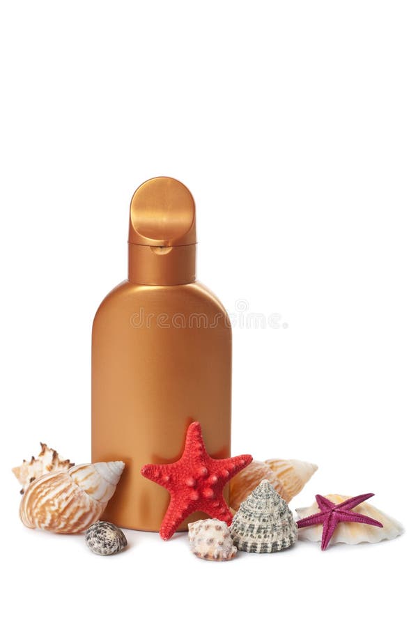 Suntan lotion and sea shells isolated