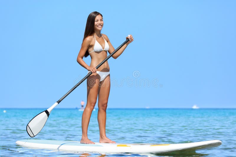 SUP Stand up paddle board woman paddleboarding