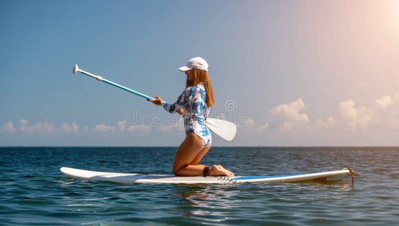 Healthy Happy Fit Woman in Bikini Relaxing on a Sup Surfboard, Floating ...