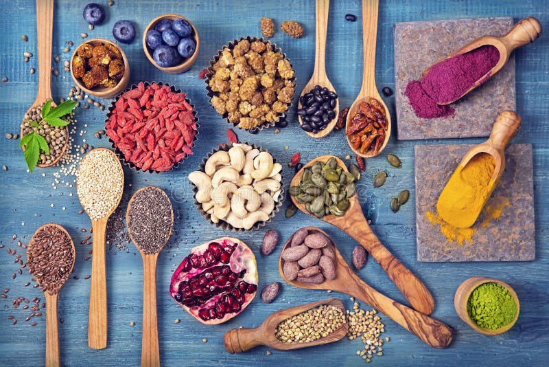 Super foods in spoons and bowls stock photos Super foods in spoons and bowls stock photos