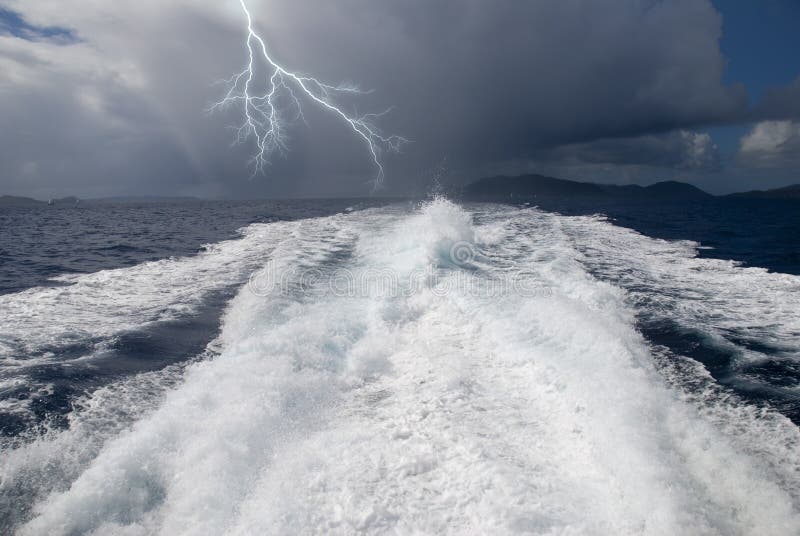 The wake from a high-speed boat as it heads away from a storm. The wake from a high-speed boat as it heads away from a storm.