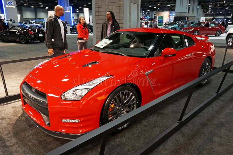 Photo of 2016 red nissan gt-r at the washington dc auto show on 1/28/16. This car is an affordable supercar featuring a 545 hp v6 engine and a price of $101770. More powerful versions are available. Photo of 2016 red nissan gt-r at the washington dc auto show on 1/28/16. This car is an affordable supercar featuring a 545 hp v6 engine and a price of $101770. More powerful versions are available.