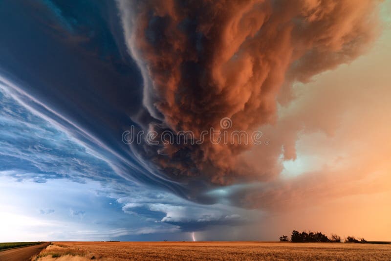 Percell thunderstorm with dramatic storm clouds and lightning during a severe weather outbreak in Kansas. Percell thunderstorm with dramatic storm clouds and lightning during a severe weather outbreak in Kansas.