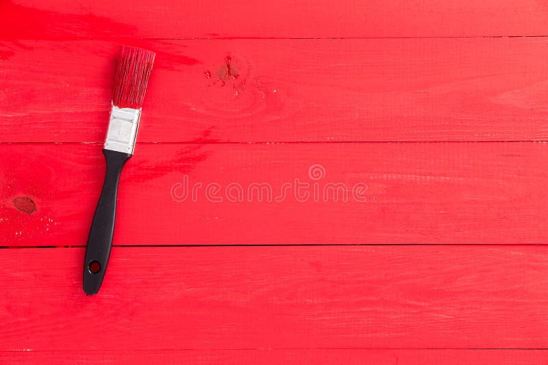 Superficie di legno dipinta rosso luminoso con la spazzola fotografie stock Superficie di legno dipinta rosso luminoso con la spazzola fotografie stock