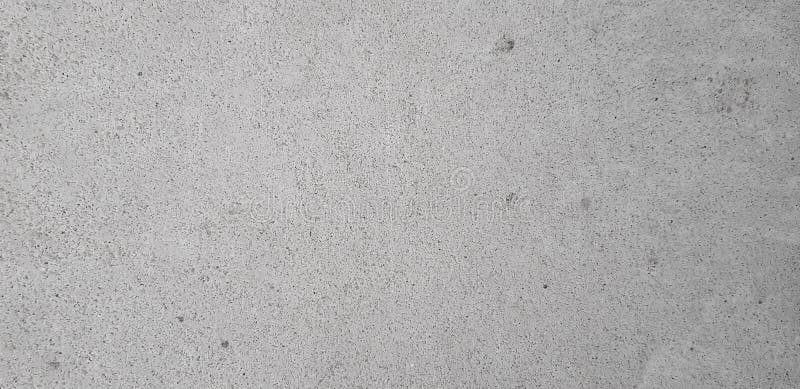 Superficie grigia del muro di cemento con struttura regolare immagine stock libera da diritti Superficie grigia del muro di cemento con struttura regolare immagine stock libera da diritti