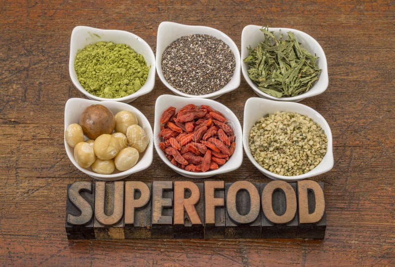 Superfood abstract matcha green tea, chia seeds, stevia herb, macadamia nuts, goji berry and hemp seed hearts with a text in vintage letterpress wood type. Superfood abstract matcha green tea, chia seeds, stevia herb, macadamia nuts, goji berry and hemp seed hearts with a text in vintage letterpress wood type