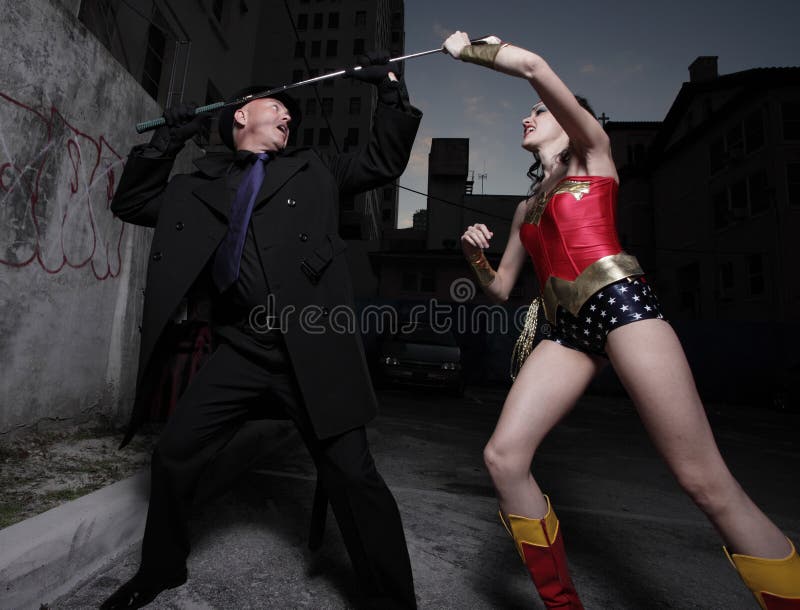 Superhero and evil villain fighting