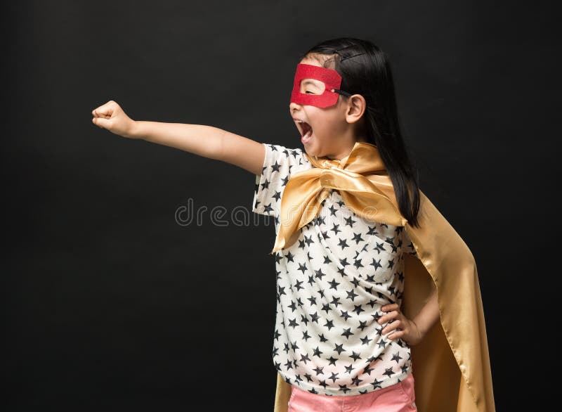 Superhero kids on a black background royalty free stock image