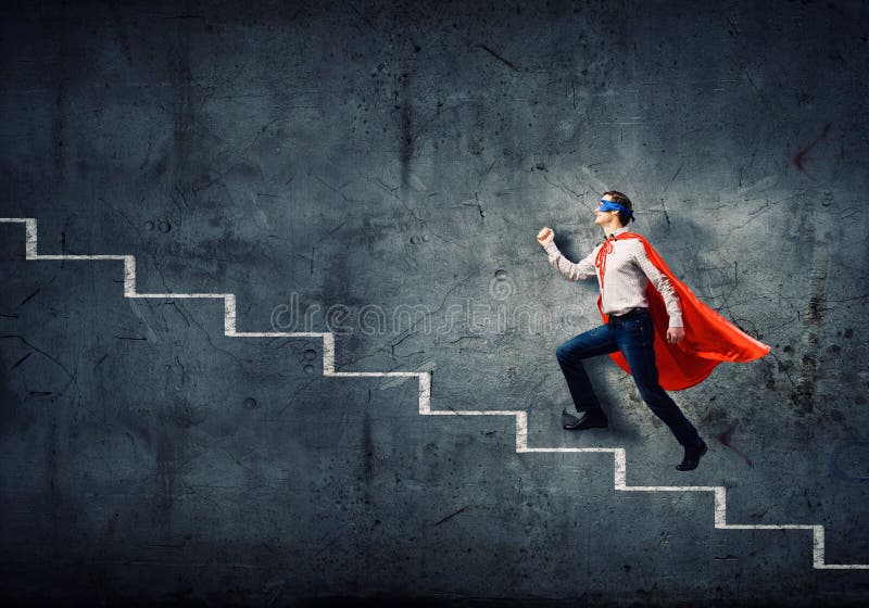 Supermann auf Leiter lizenzfreies stockfoto Supermann auf Leiter lizenzfreies stockfoto
