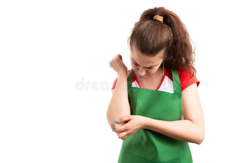 Supermercato della donna o dolore al minuto del gomito di sofferenza del lavoratore immagini stock libere da diritti Supermercato della donna o dolore al minuto del gomito di sofferenza del lavoratore immagini stock libere da diritti