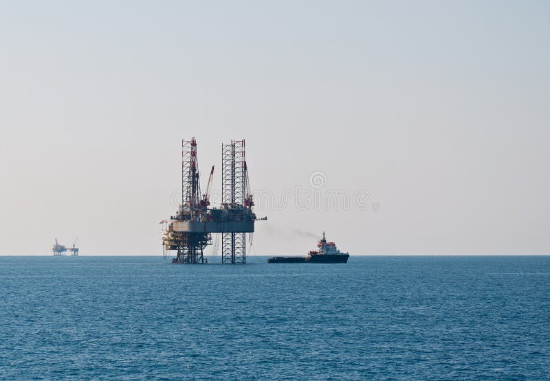 Supply boat and semisubmersible oil rig in southern Mediterranean, Egyptian offshore. Supply boat and semisubmersible oil rig in southern Mediterranean, Egyptian offshore